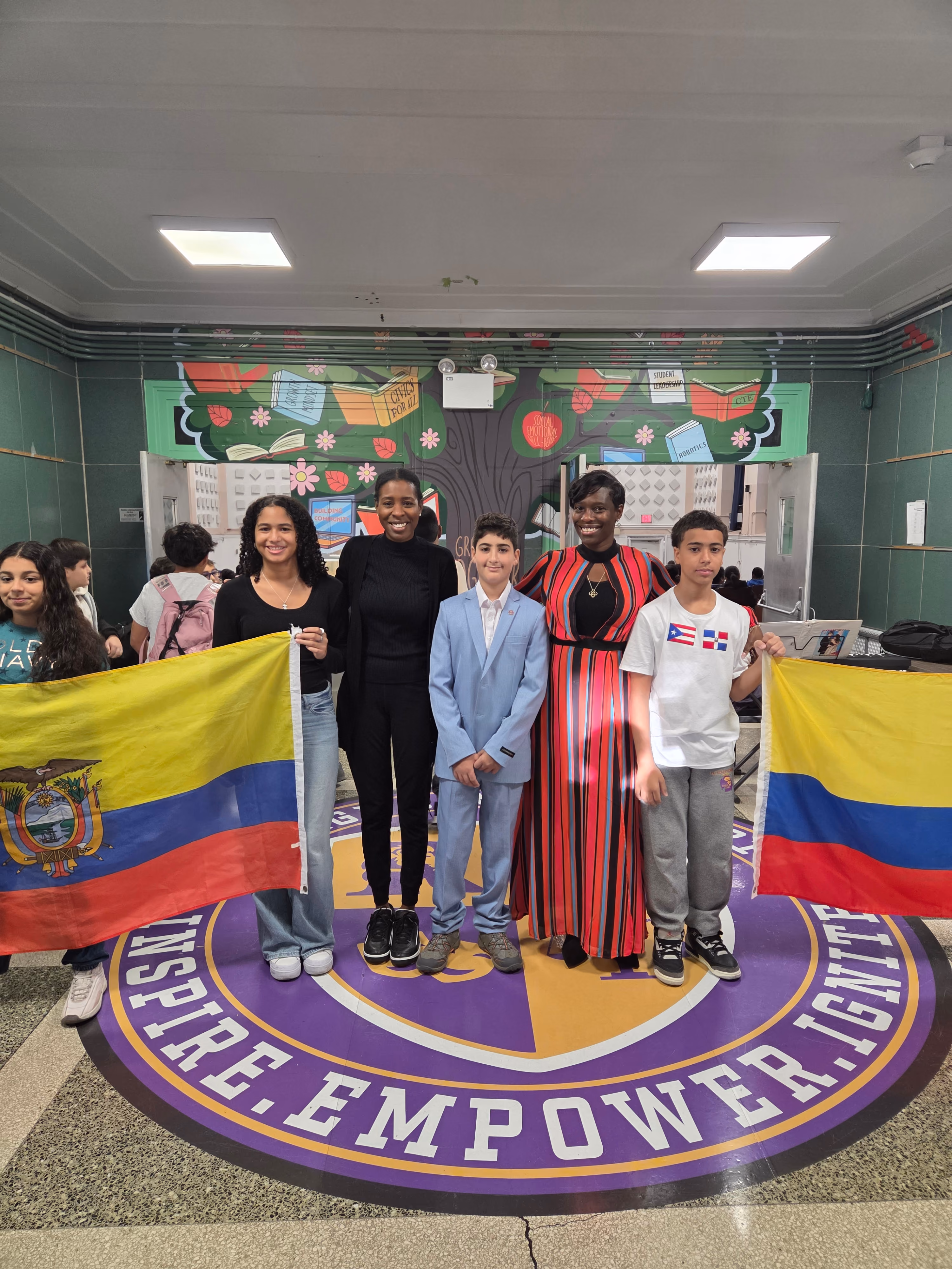 Students and staff celebrating cultural heritage with Colombian flag