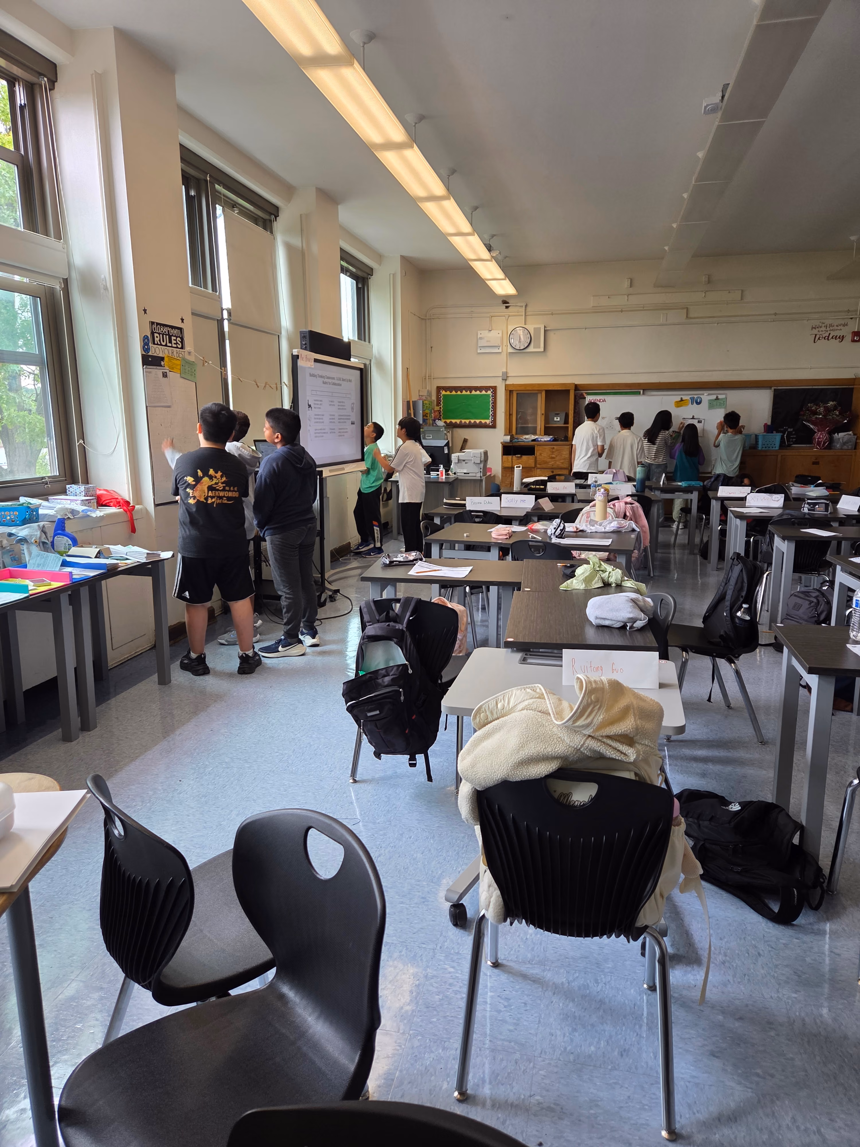 Students working at tables in classroom