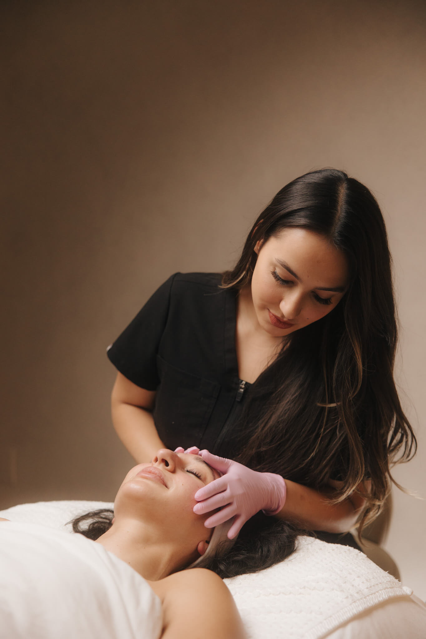 Licensed aesthetic provider performing a professional chemical peel treatment for smoother, brighter skin in Queen Creek, Arizona.