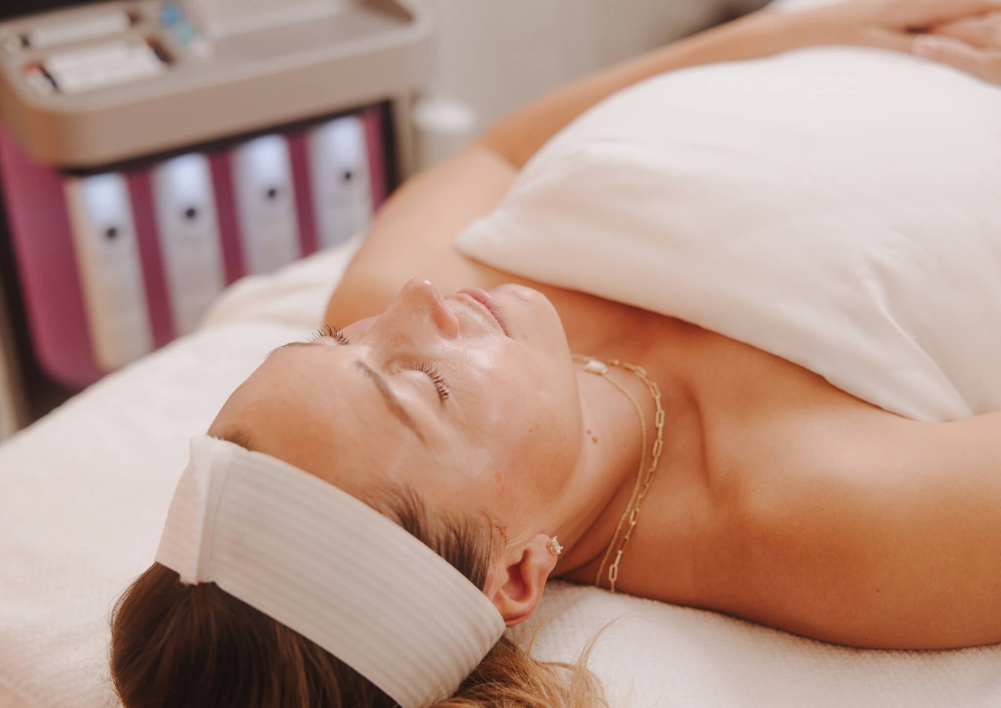 Esthetician consulting with a client on the best skin treatment options in Queen Creek, Arizona