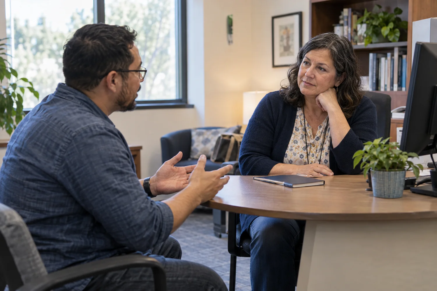 A student and a college staff member discussing a question.