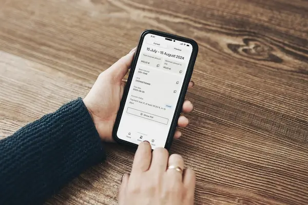 Bag on a table with coins scattered