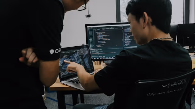 Developer reviewing code and performance data during a technical web audit.
