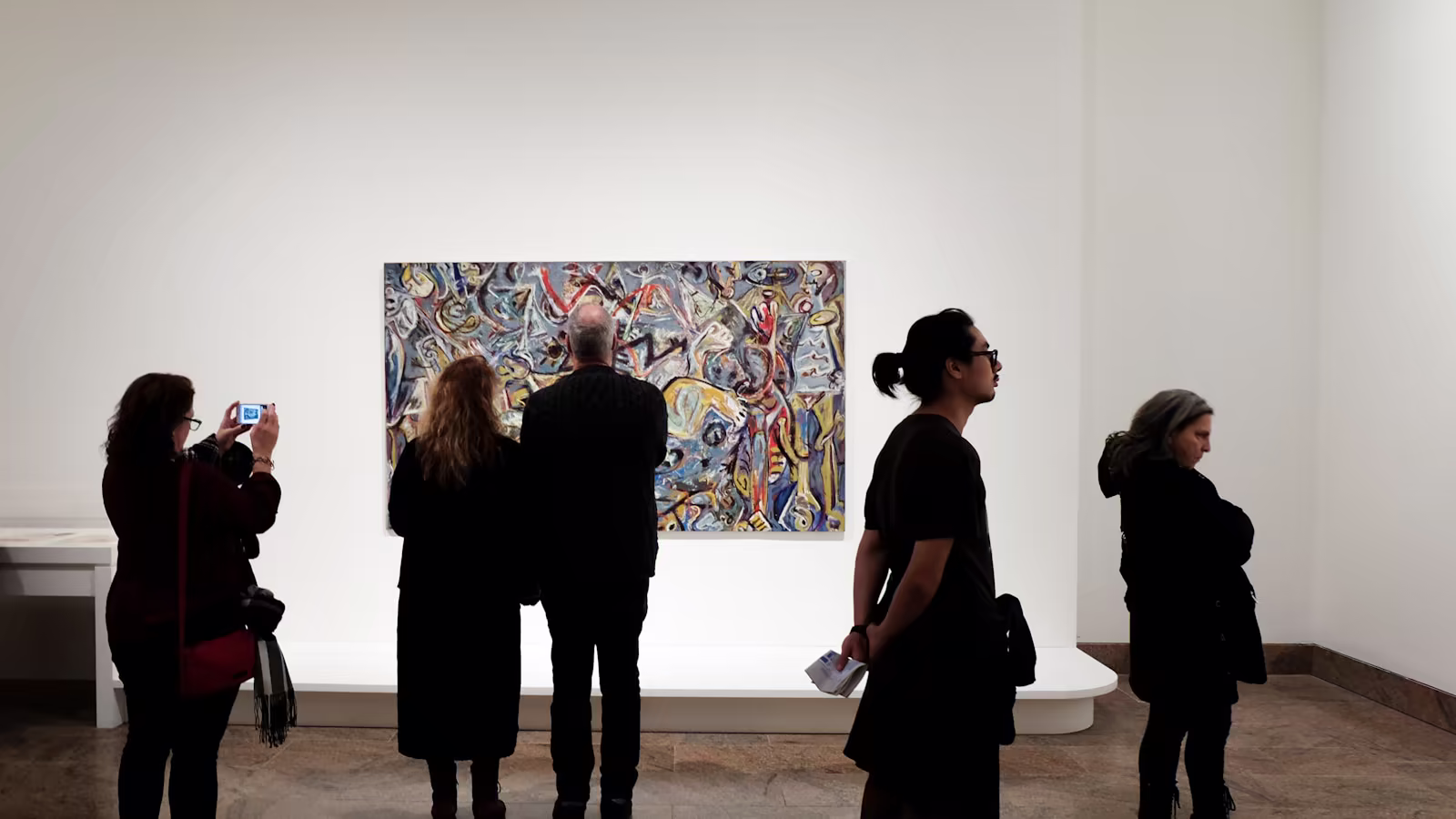 Visitors progressing through an exhibition organized by sequences