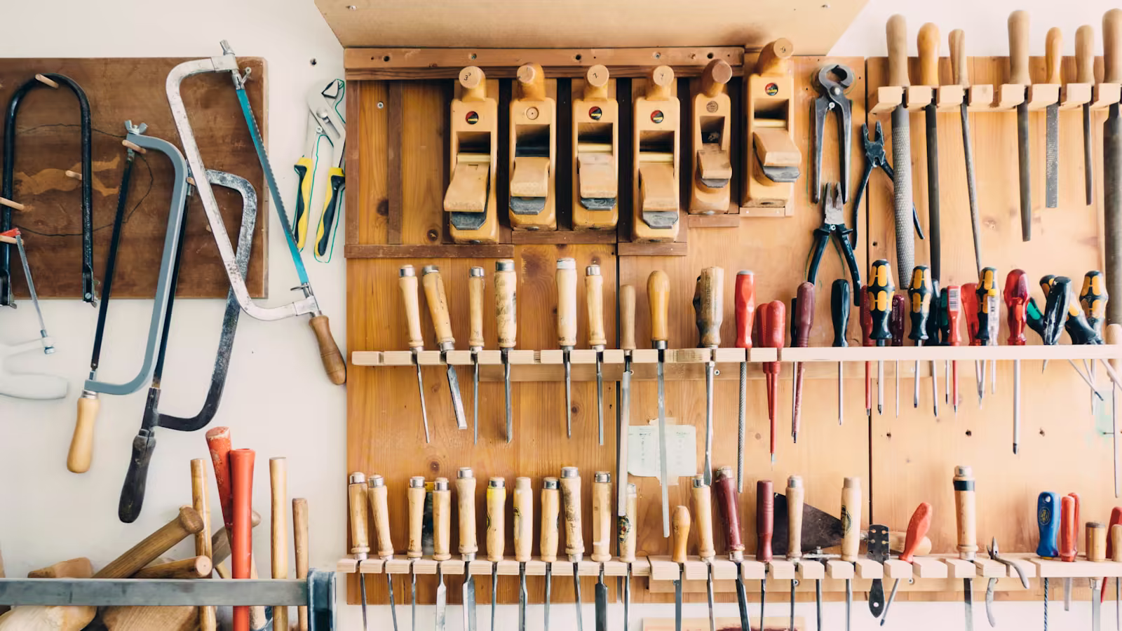 Carefully maintained precision tools on a dark workbench