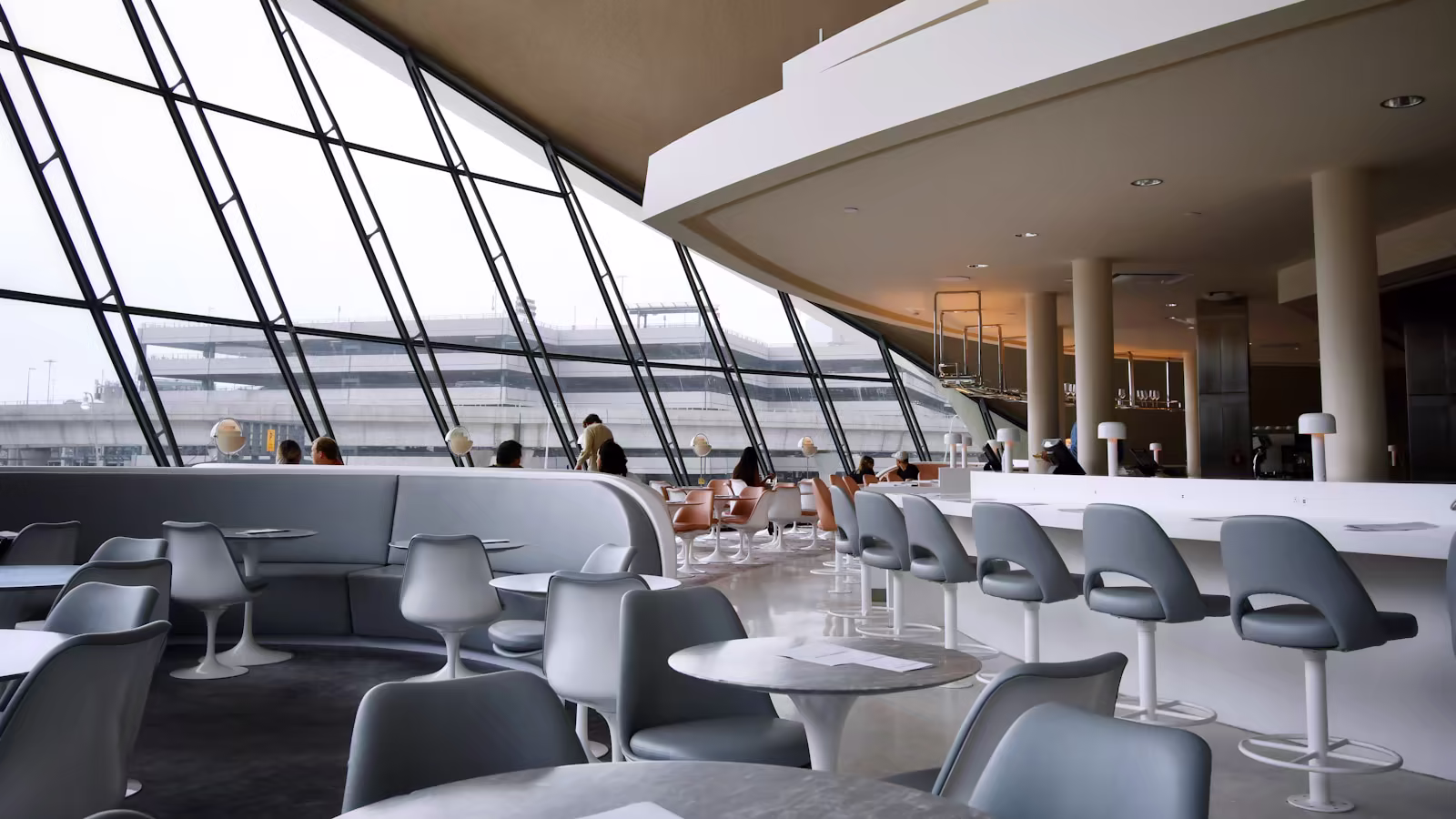 A B2B decision maker working in a contemporary airport lounge