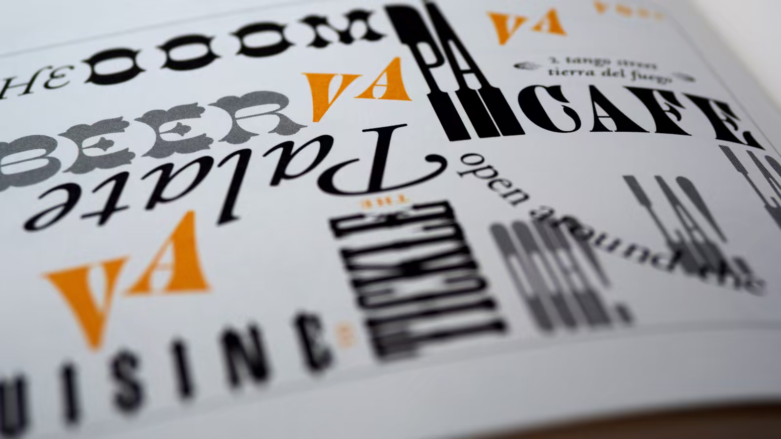 Typographic proofs compared on a studio wall