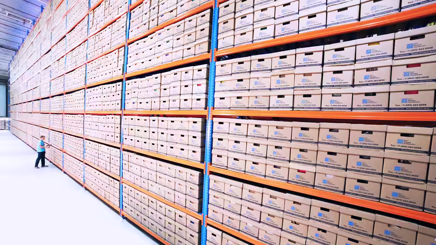 Archive boxes sorted between conservation, restoration and elimination