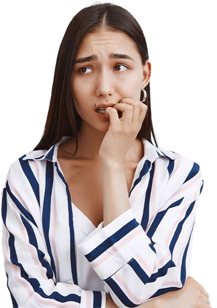 Nervous young woman biting her nails while looking away, wearing a striped shirt.