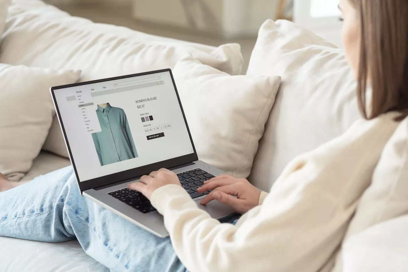 A woman online shopping on a laptop. 