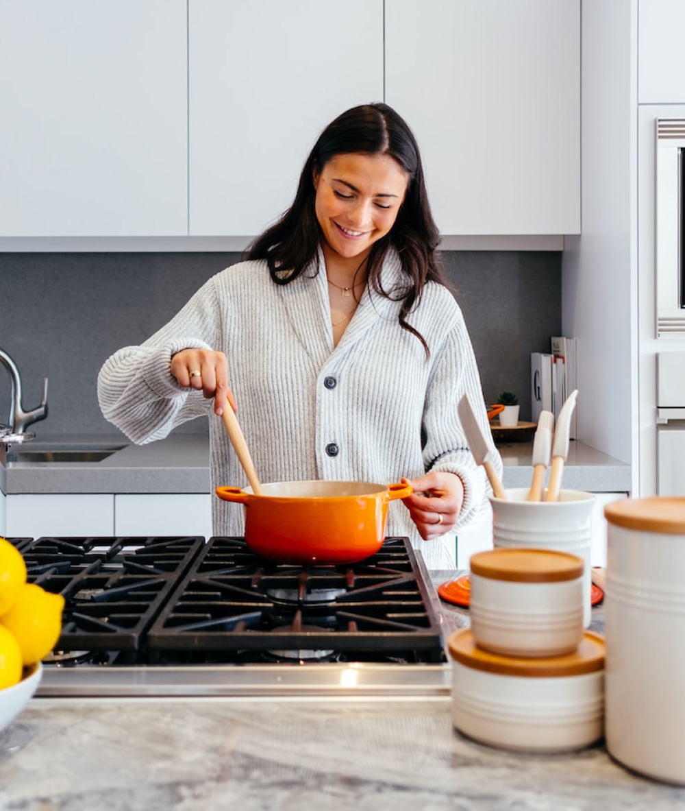 Cooking in kitchen at stove