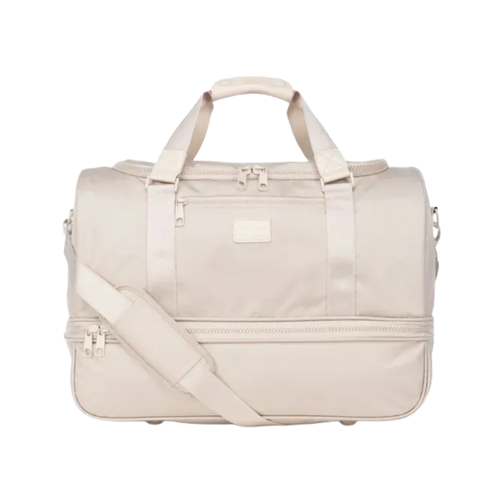 ntroducing the must-have shoe compartment duffel bag, the Stevyn Duffel. Lightweight and spacious, the versatile Stevyn Duffel is designed for everyday wear as a weekender, gym bag, or carry-on. Featuring a luggage sleeve and interior pockets, it offers convenience and organization on the go. Made for both men and women, this sleek duffel will elevate your style wherever your travels take you.