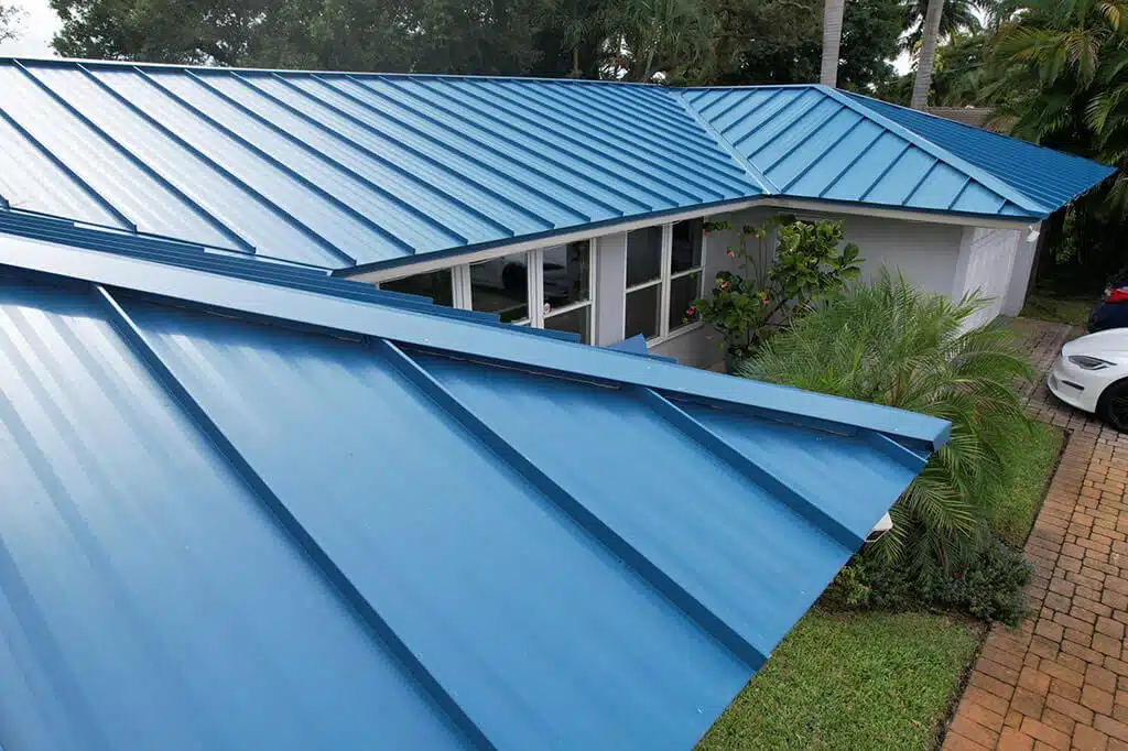 Aerial photo of blue standing seam metal roof.