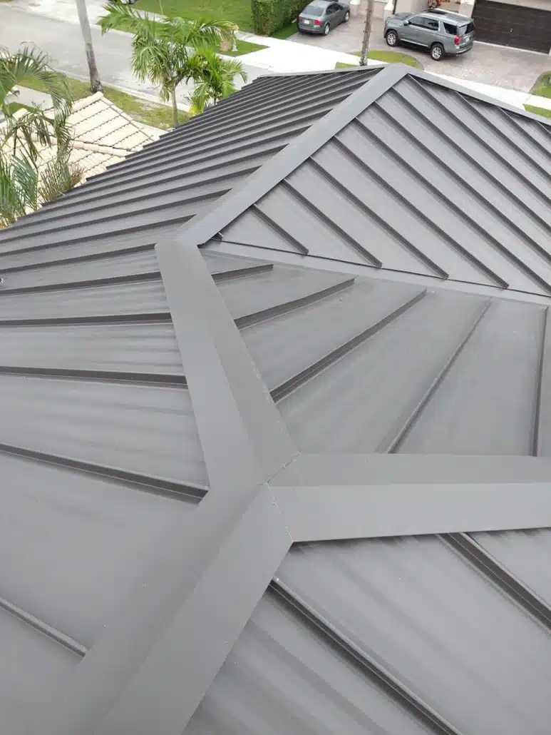 Aerial photo of gray standing seam metal roof.