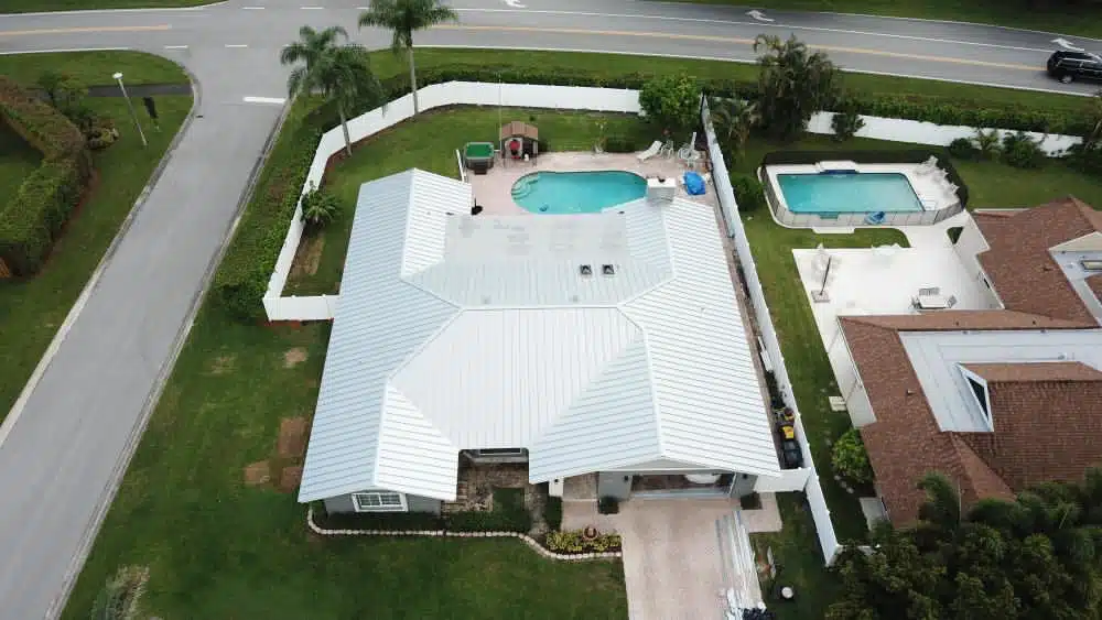 Aerial photo of white standing seam metal roof.