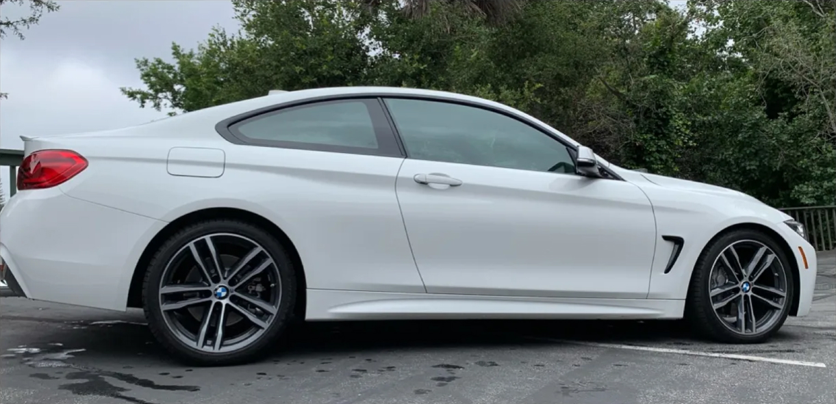 a white car parked in a parking lot