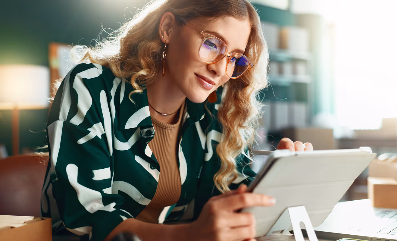 A woman looking at tablet
