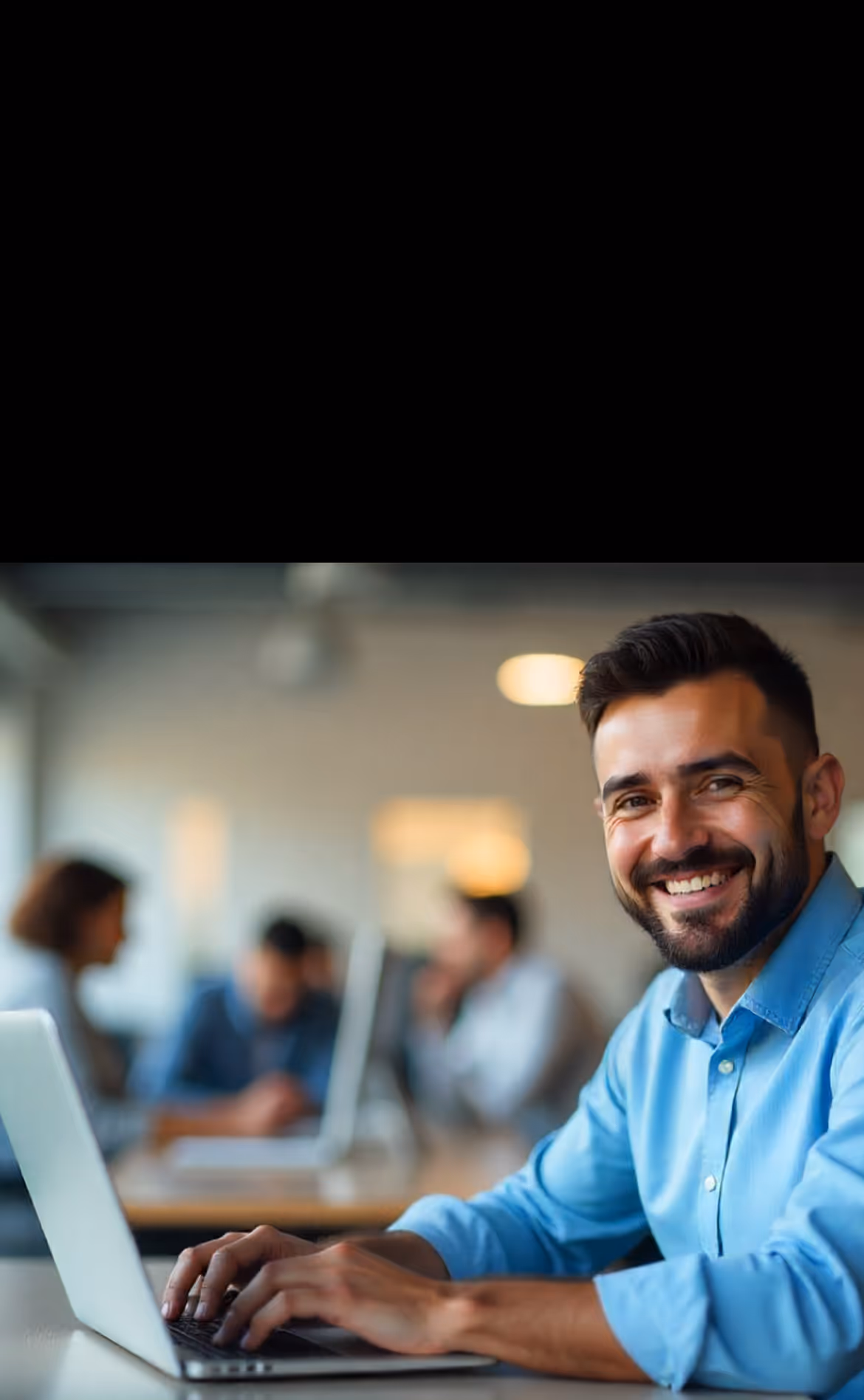 A man typing on laptop
