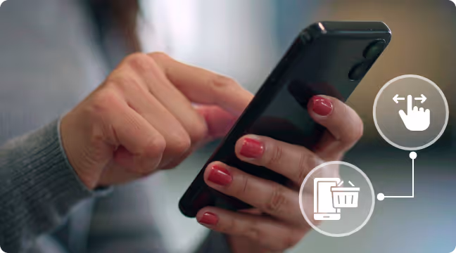 Close-up of hands with red nail polish holding and interacting with a black smartphone.