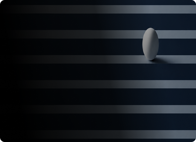 A single white egg standing upright on a dark striped surface with horizontal light bands.