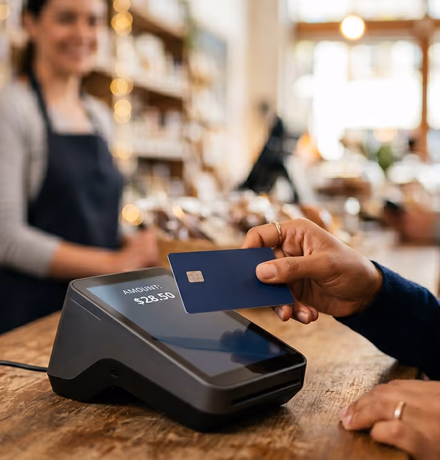 Customer paying by card at a store POS