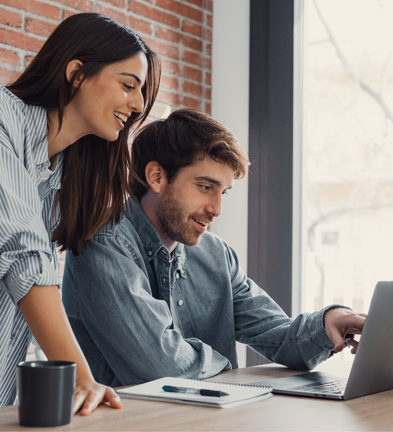 Team planning at a laptop