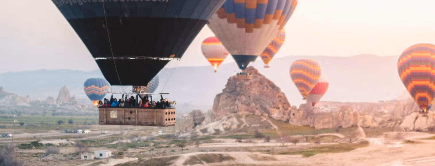 A group of hot air balloons flying in the sky.