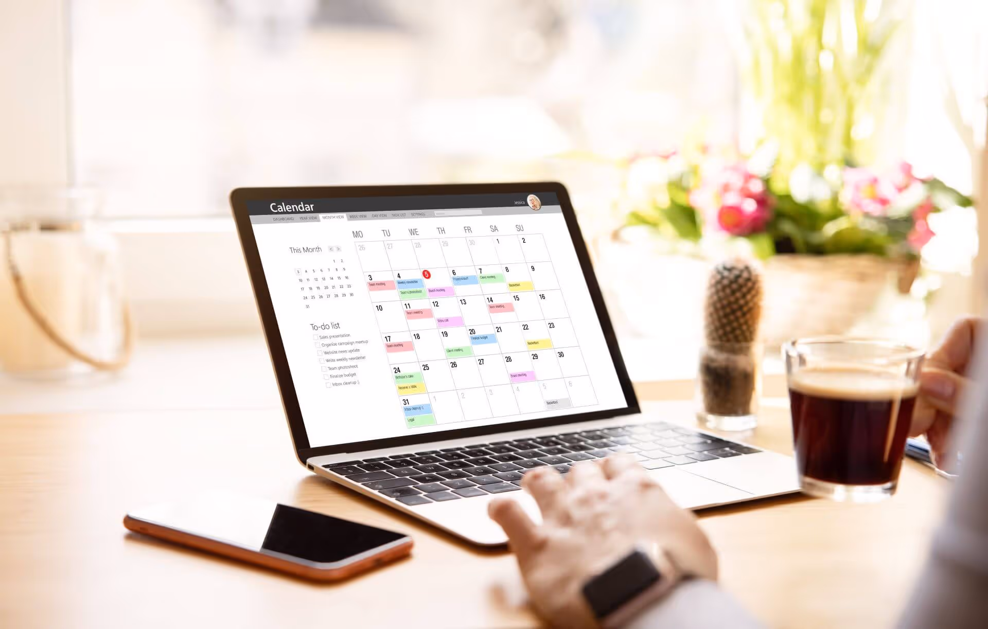woman looking calendar laptop computer