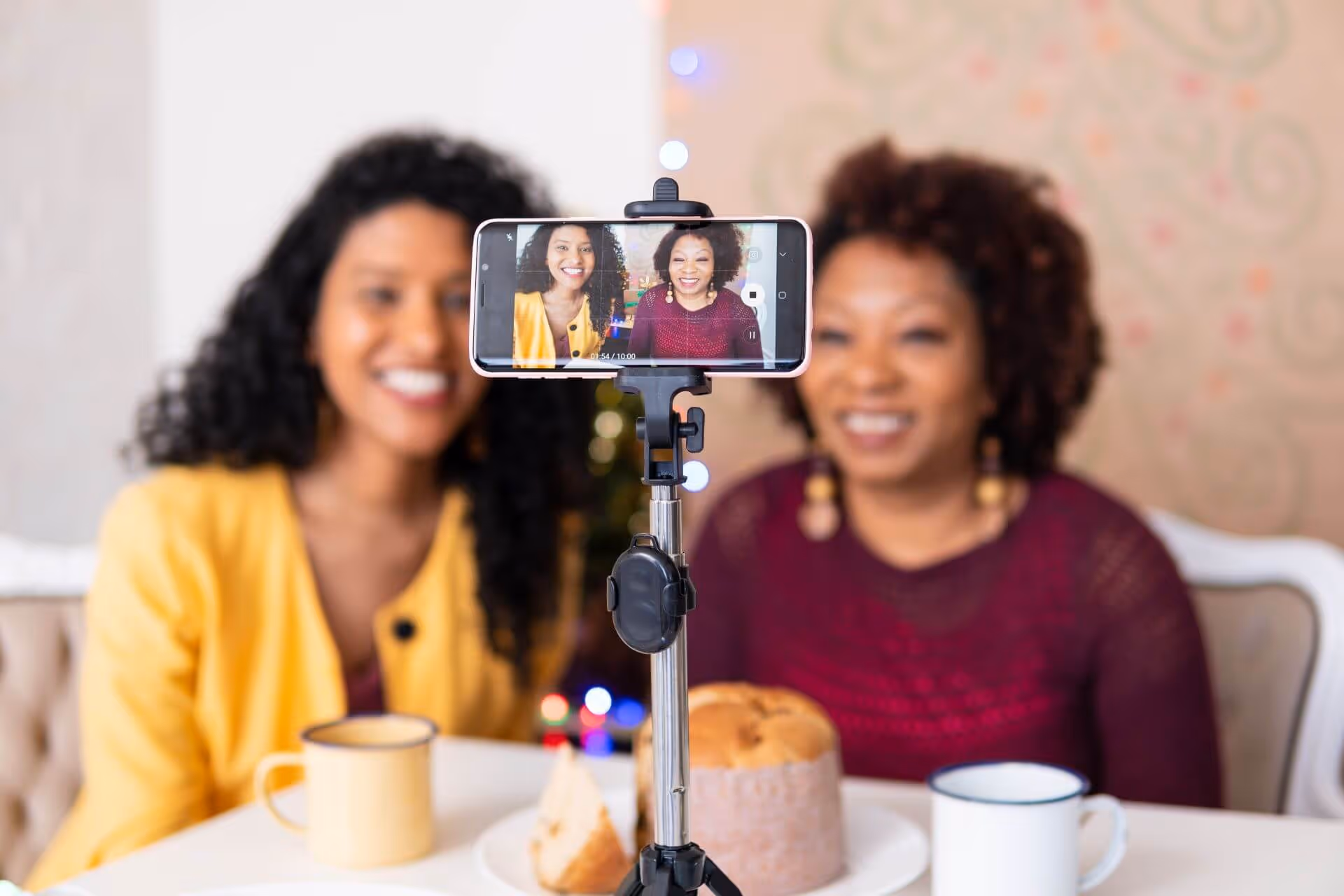 smiling women blogging home