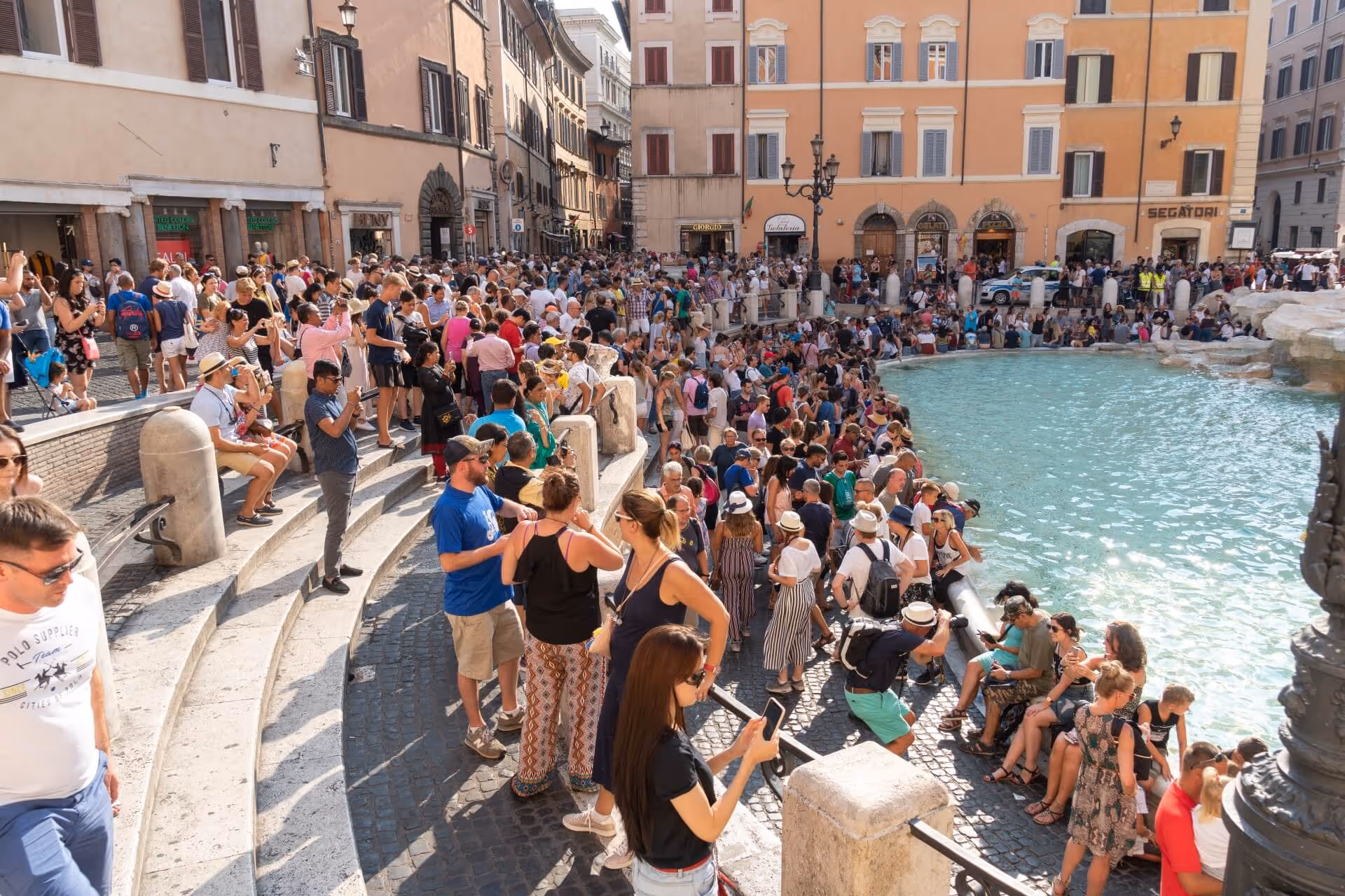 tourists at the Trevi fountain in rome