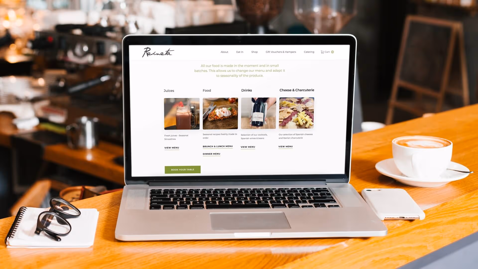 View restaurant menu on laptop at a cafe