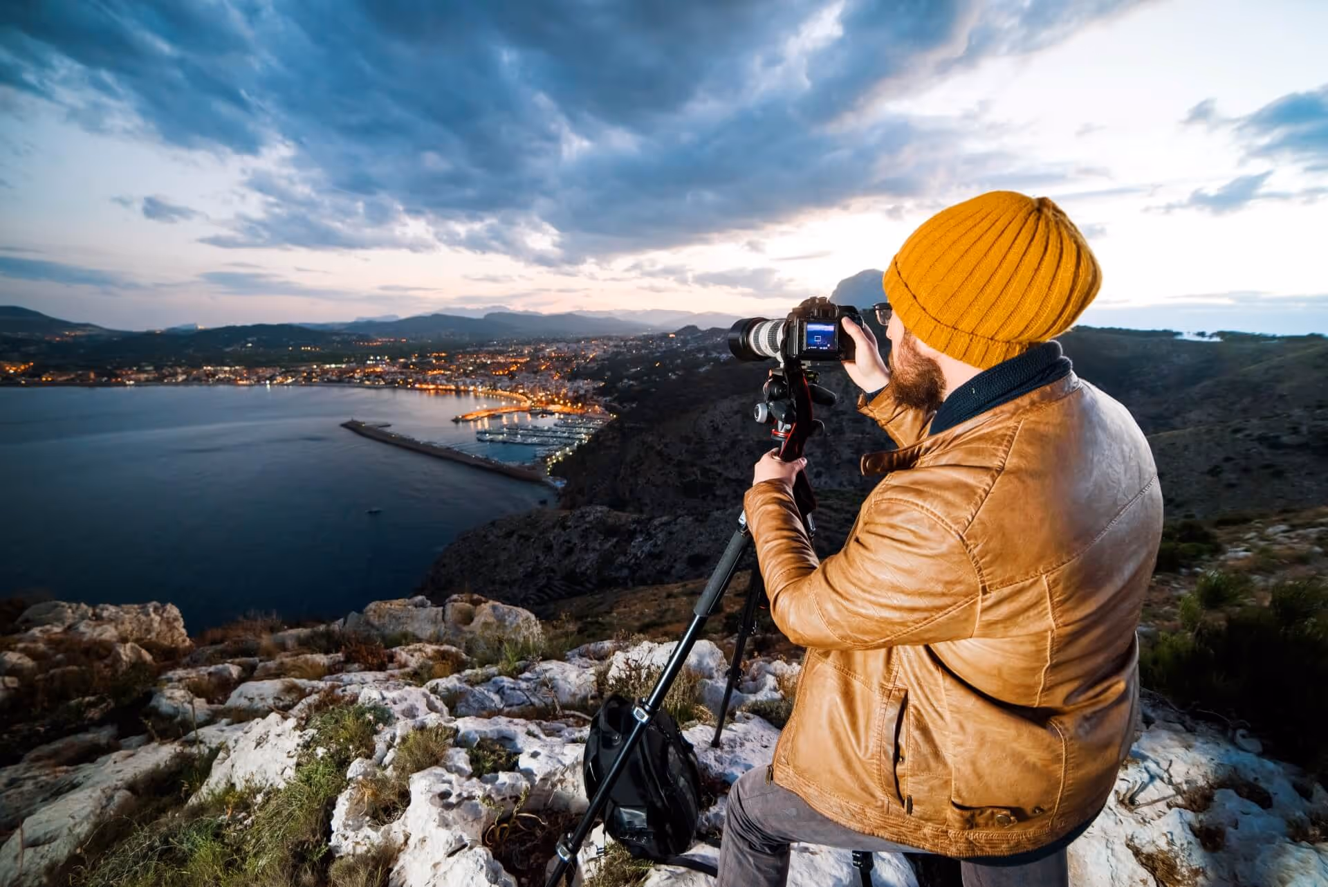 photographer taking photos at sunset