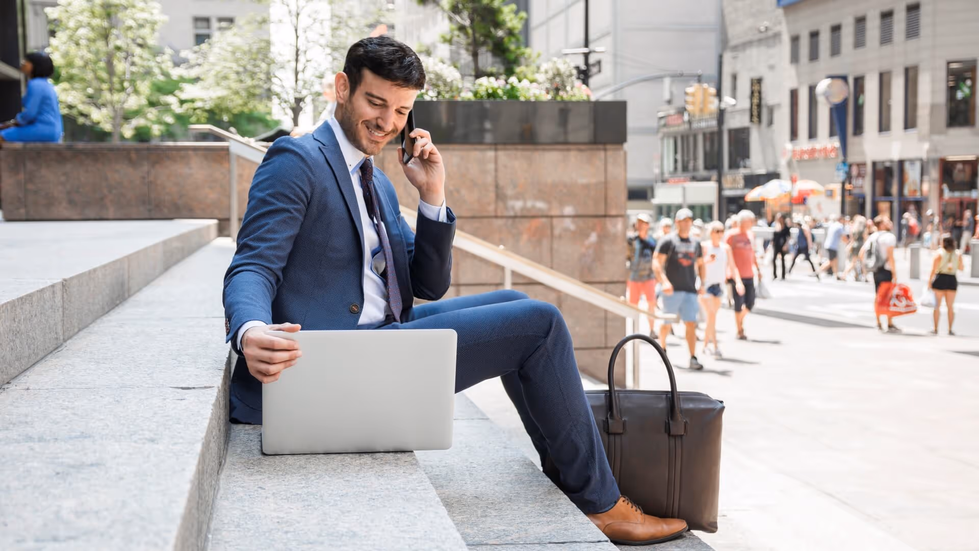 businessman talking phone using laptop