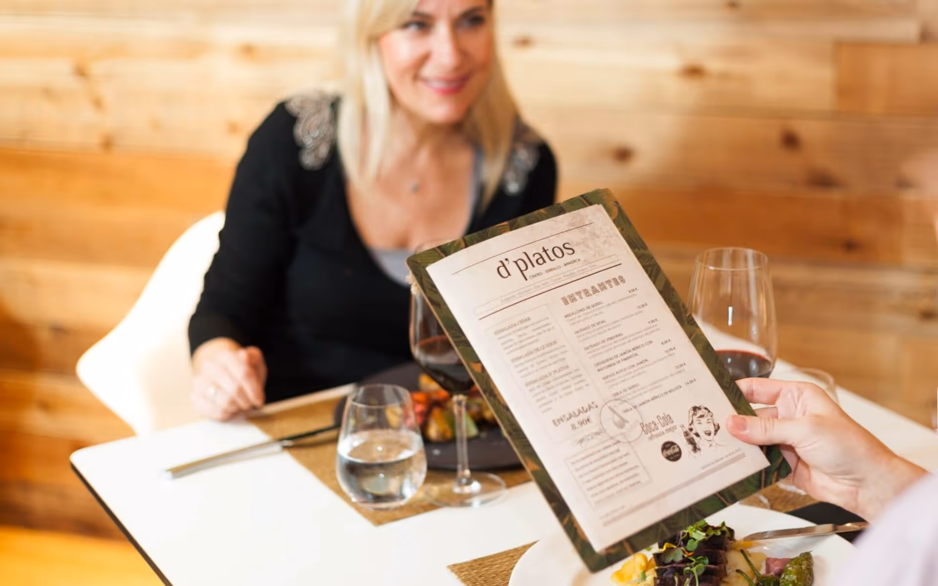 Couple sitting at restaurant looking at a menu