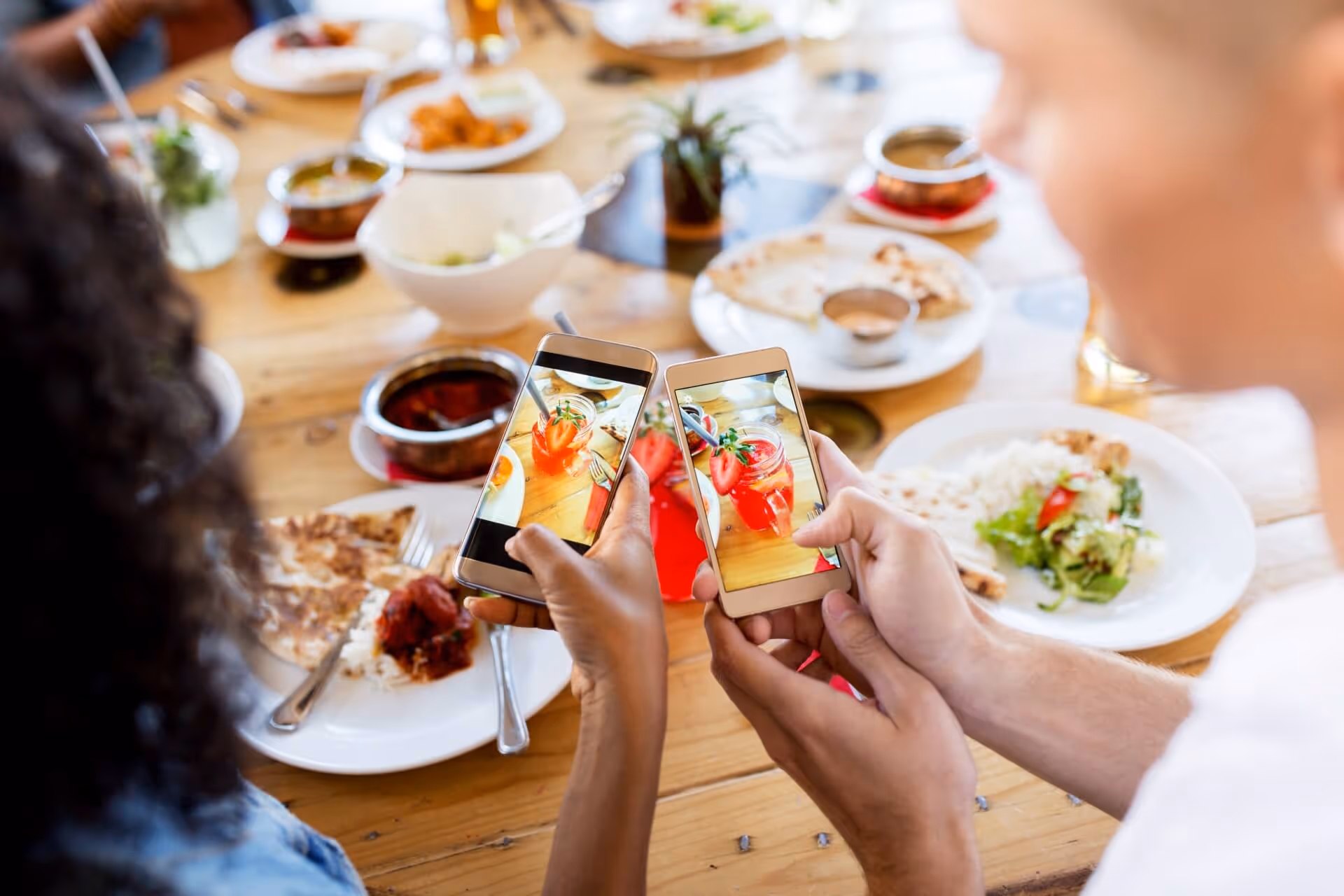 Friends taking photos of a drink