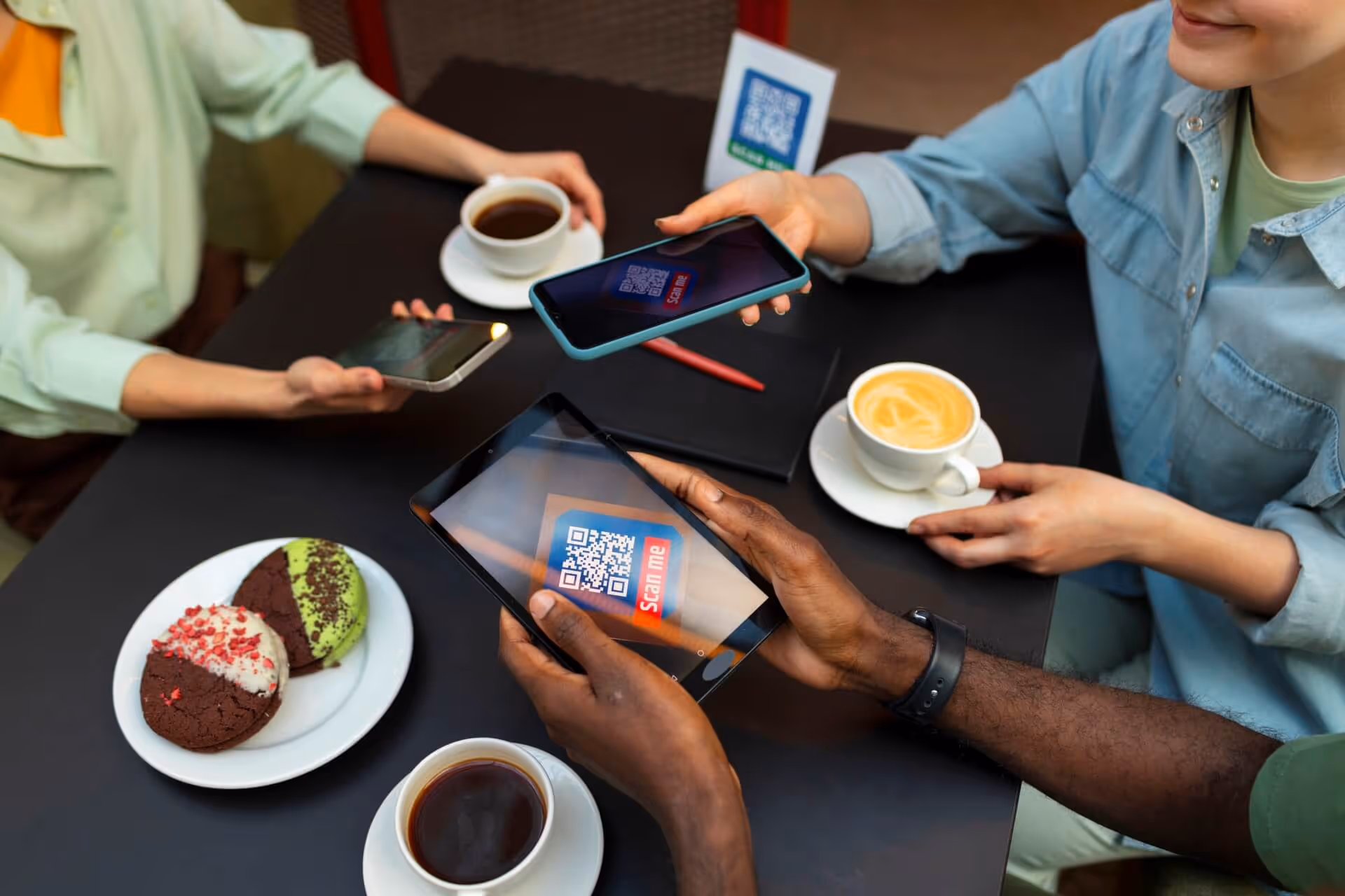 friends reading menu at restaurant