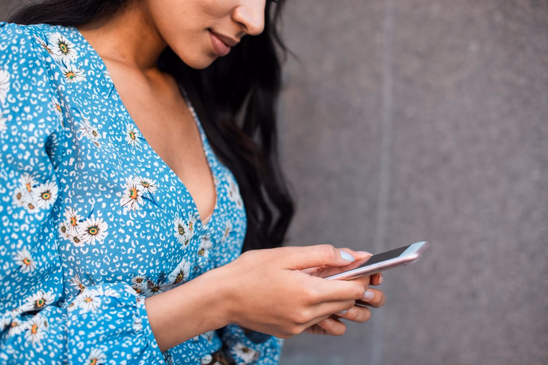 close up of woman using her phone
