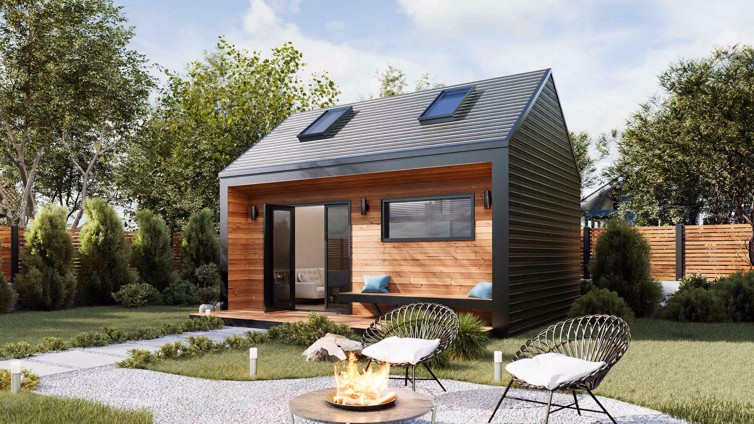 Tiny prefab house with pitched roof and modern design featuring natural wood facade and black metal details