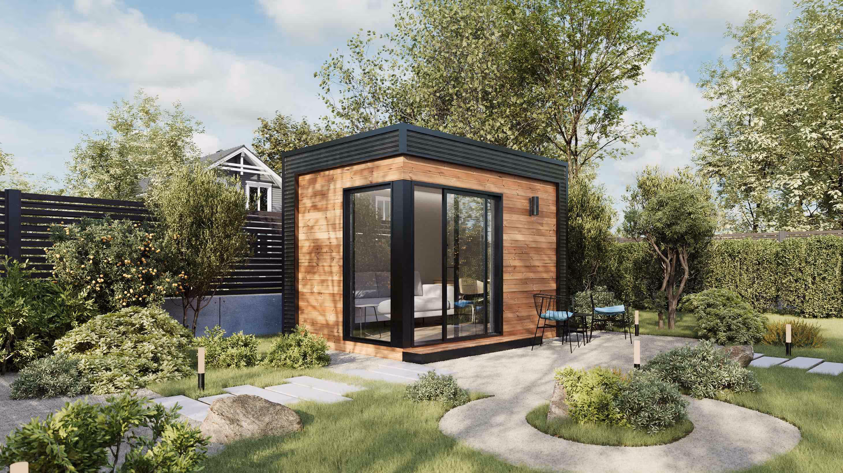 Corner view of modern prefab backyard office in a backyard with trees and stone pathways