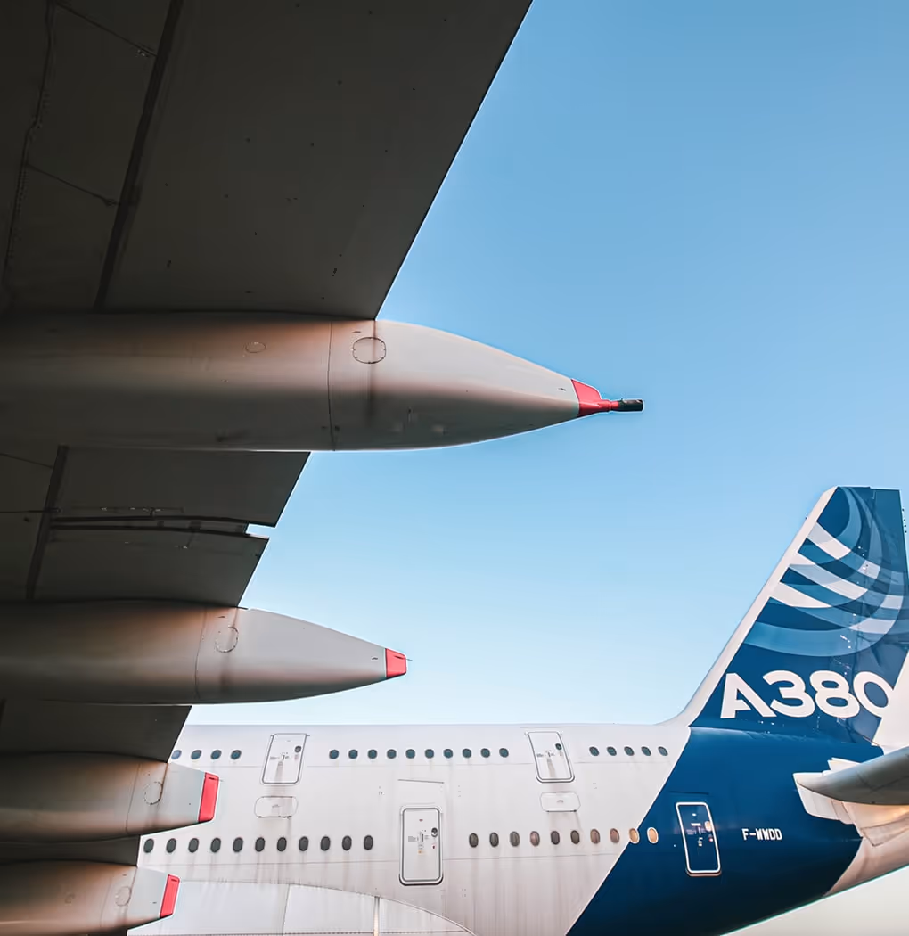 A large jetliner sitting on top of an airport tarmac.