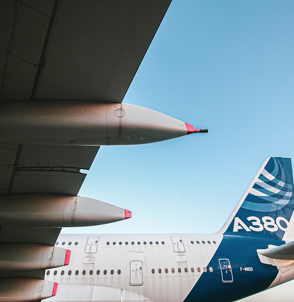 A large jetliner sitting on top of an airport tarmac.