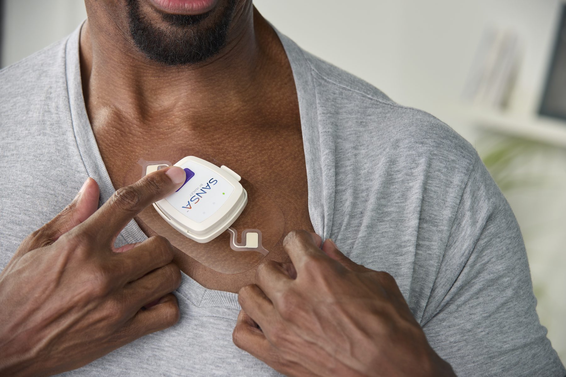 A patient wearing the SANSA patch at home