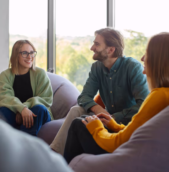 People talking to each other and smiling