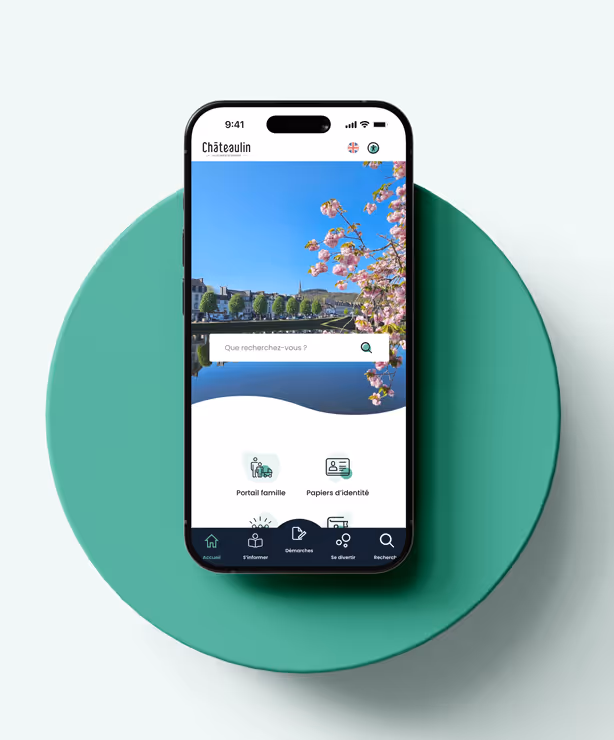 Affichage en gros plan de l'application mobile de Châteaulin, ouverte sur une interface claire et intuitive avec fond fleuri et accès rapide aux démarches.