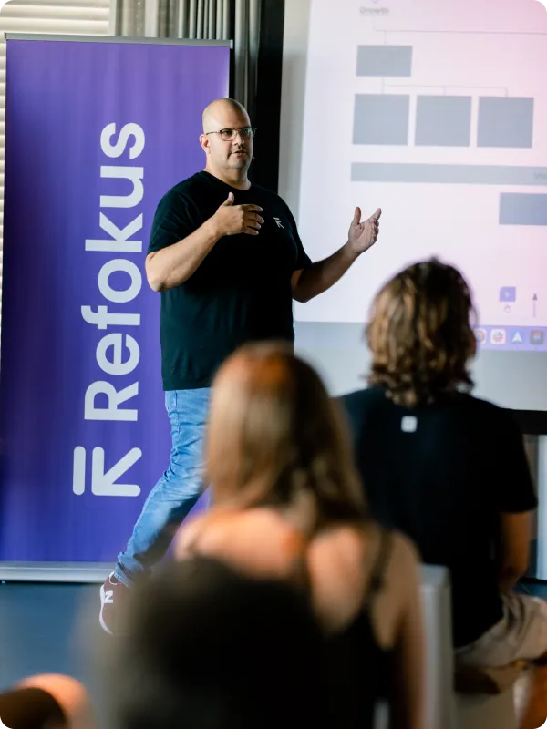 Refokus CEO Leo speaking in front of an audience
