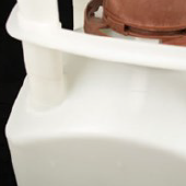 Close-up of a white plastic container with a brown lid.