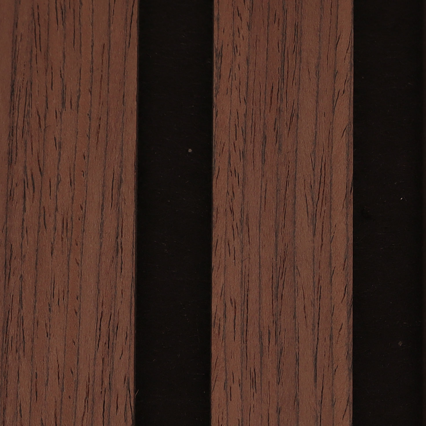 Close-up of brown wooden planks with visible grain texture separated by dark gaps.