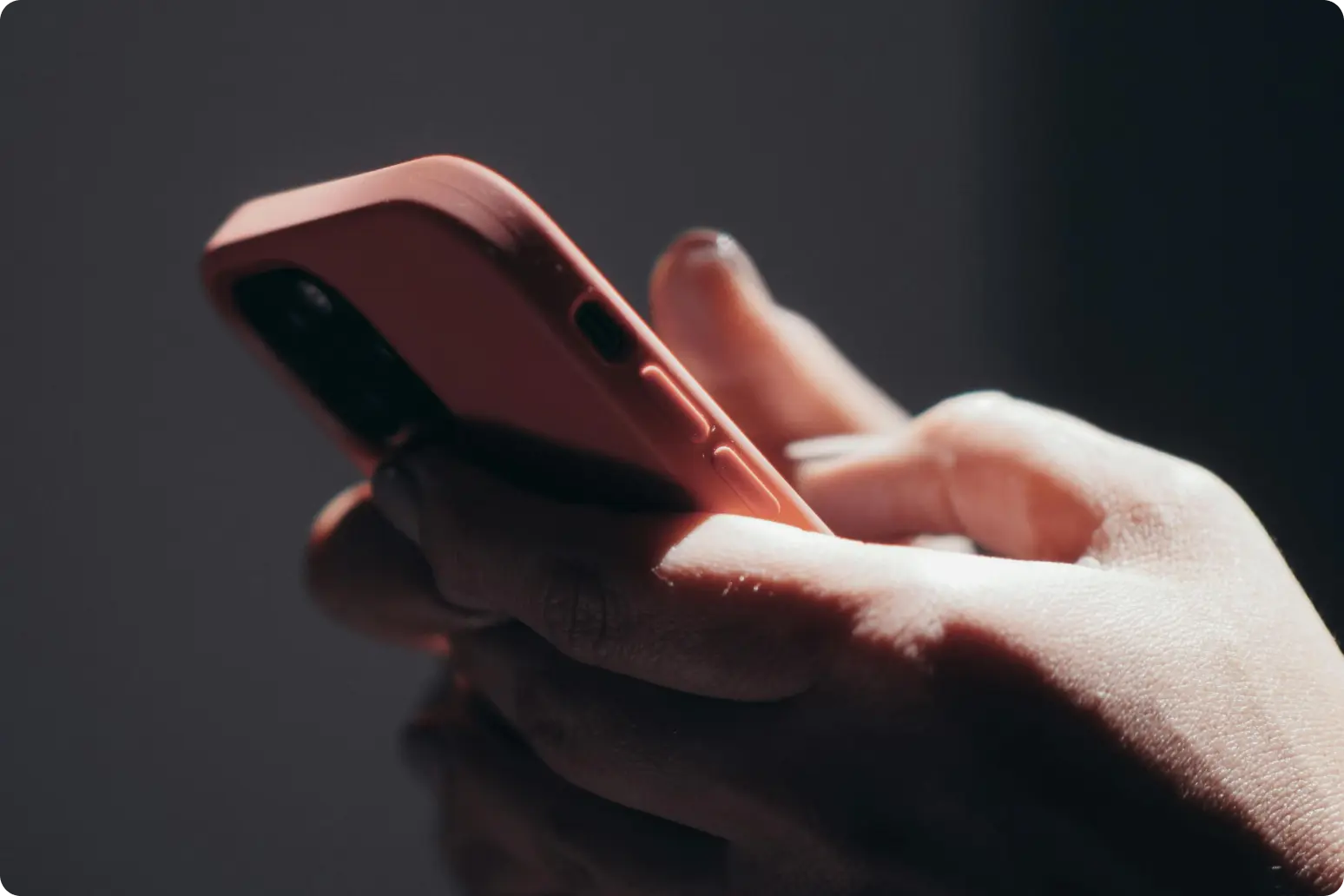 Close up of two hands holding a smartphone