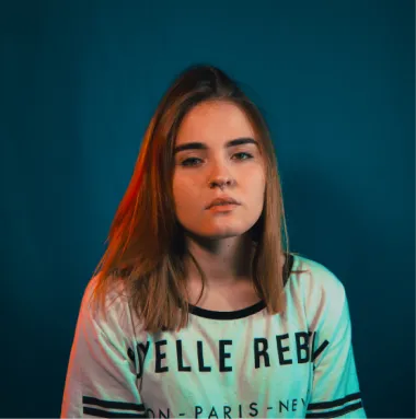 a close up of a woman with long hair wearing a shirt