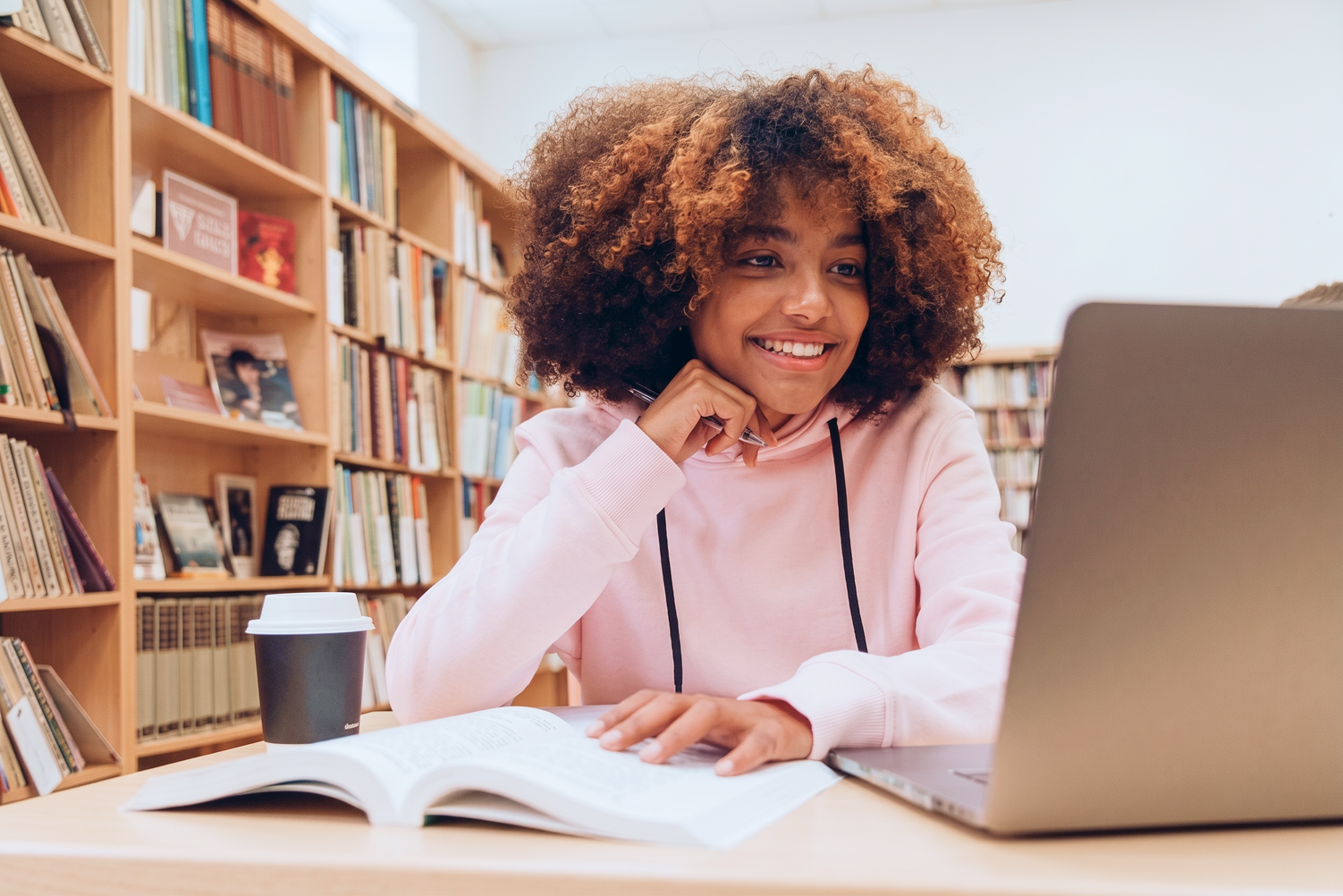 University students working collaboratively in a university library.